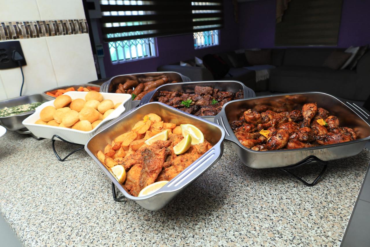 Traditional South African buffet with chicken, potatoes and sides